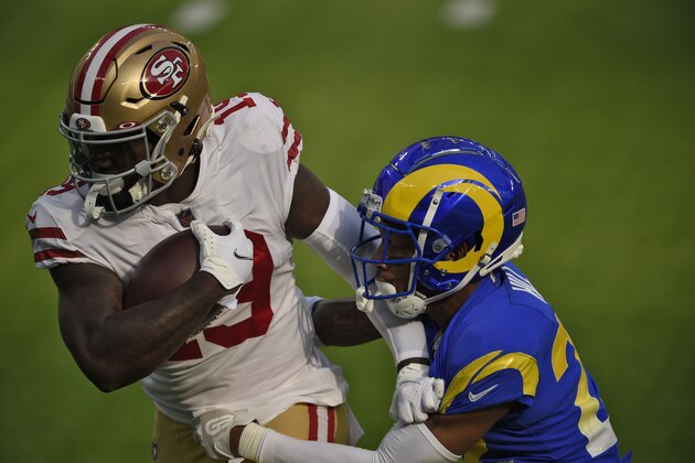 San Francisco 49ers wide receiver Deebo Samuel, left, carries against the Los Angeles Rams during the first half of an NFL football game Sunday, Nov. 29, 2020, in Inglewood, Calif. (AP Photo/Kelvin Kuo)
