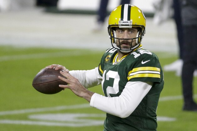 Green Bay Packers' Aaron Rodgers warms up before an NFL football game against the Chicago Bears Sunday, Nov. 29, 2020, in Green Bay, Wis. (AP Photo/Mike Roemer)
