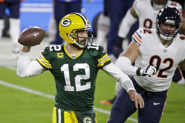 Green Bay Packers' Aaron Rodgers throws during the first half of an NFL football game against the Chicago Bears Sunday, Nov. 29, 2020, in Green Bay, Wis. (AP Photo/Mike Roemer)