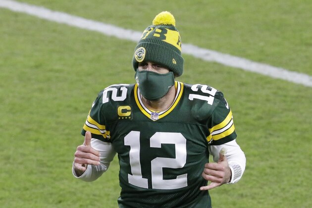 Green Bay Packers' Aaron Rodgers reacts as he runs off the field after an NFL football game against the Chicago Bears Sunday, Nov. 29, 2020, in Green Bay, Wis. The Packers won 41-25. (AP Photo/Mike Roemer)