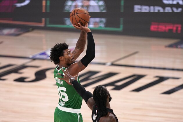 Boston Celtics guard Marcus Smart (36) goes up for a shot over Miami Heat's Jae Crowder during the second half of Game 4 of an NBA basketball Eastern Conference final, Wednesday, Sept. 23, 2020, in Lake Buena Vista, Fla. (AP Photo/Mark J. Terrill)