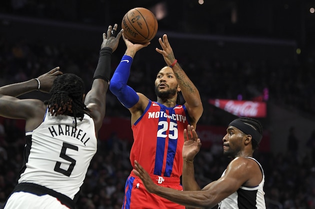 Detroit Pistons guard Derrick Rose, center, shoots as Los Angeles Clippers forward Montrezl Harrell, left, and forward Maurice Harkless defend during the second half of an NBA basketball game, Thursday, Jan. 2, 2020, in Los Angeles. The Clippers won 126-112. (AP Photo/Mark J. Terrill)