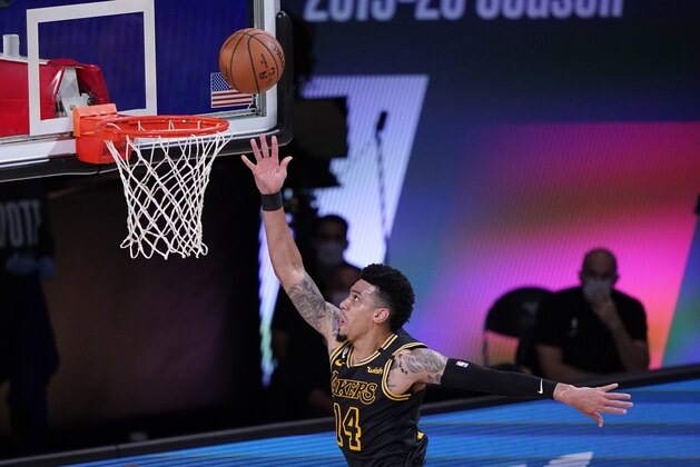 Los Angeles Lakers' Danny Green (14) drives to the basket during the first half of an NBA conference final playoff basketball game against the Denver Nuggets Sunday, Sept. 20, 2020, in Lake Buena Vista, Fla. (AP Photo/Mark J. Terrill)