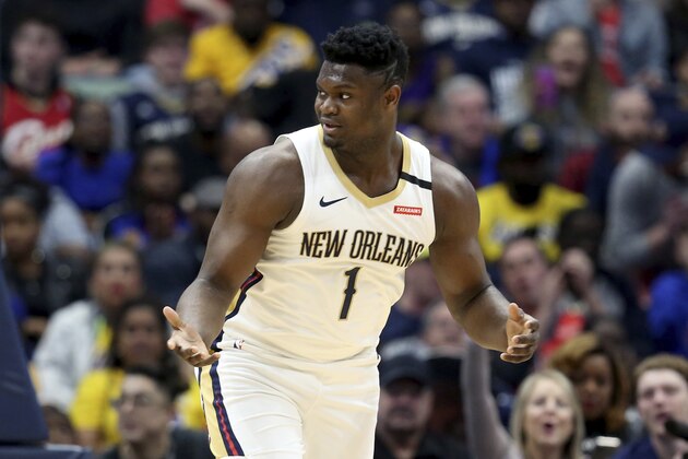 New Orleans Pelicans forward Zion Williamson (1) reacts after a basket in the first half of an NBA basketball game in New Orleans, Sunday, March 1, 2020. (AP Photo/Rusty Costanza)