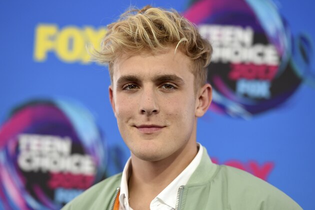 FILE - Internet personality Jake Paul arrives at the Teen Choice Awards in Los Angeles on Aug. 13, 2017. FBI agents including a SWAT team have raided the apparent home of YouTube star Jake Paul. FBI spokeswoman Laura Eimiller says agents executed a search warrant Wednesday at the Calabasas, California mansion in connection with an ongoing investigation. She could not say what the probe is about or who the target was. Helicopter video from local TV news showed agents gathering guns from the home that can frequently be seen on Paul's YouTube channel, which has over 20 million followers. (Photo by Jordan Strauss/Invision/AP, File)
