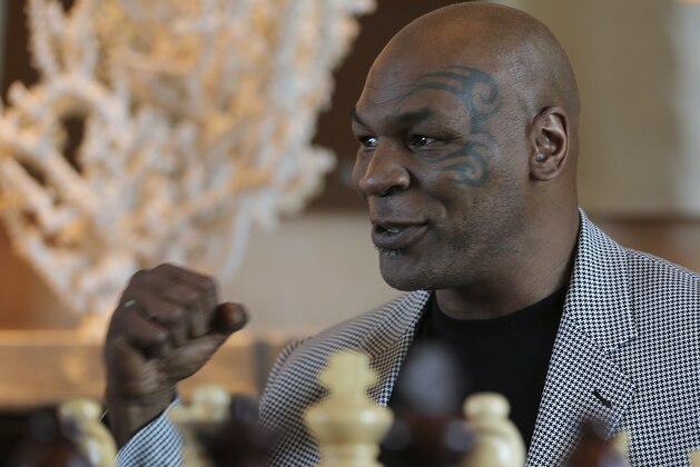 Mike Tyson makes a fist during an interview with The Associated Press, in Dubai, United Arab Emirates, Thursday, May 4, 2017. Tyson is in Dubai to announce the start of his worldwide boxing gym franchise. Tyson said Thursday that a city like Dubai can show people the best of the Middle East, its people and Islam. Tyson praised the sheikhdom as