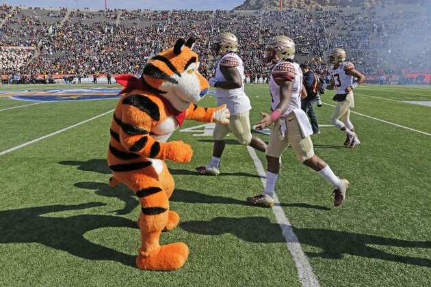 IMAGE DISTRIBUTED FOR KELLOGG'S FROSTED FLAKES - Tony the Tiger cheers football players ahead of the Florida State Seminoles and Arizona State Sun Devils matchup on Tuesday, Dec. 31, 2019, in El Paso, Texas. Tony's Mission Tiger initiative – which raises awareness and helps fund at-risk middle school sports programs – aligns with the Sun Bowl's inaugural purpose of helping underprivileged children. (Ruben Ramirez/AP Images for Kellogg's Frosted Flakes)