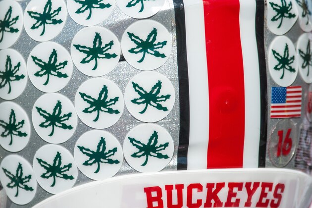 An Ohio State helmet sits on a bench during an NCAA football game against Illinois  Saturday, Nov. 14, 2015 at Memorial Stadium in Champaign, Ill.  Ohio State won 28-3.  (AP Photo/Bradley Leeb)