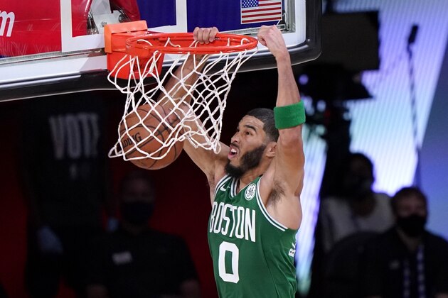Boston Celtics' Jayson Tatum (0) dunks the ball during the first half of an NBA conference final playoff basketball game against the Miami Heat on Saturday, Sept. 19, 2020, in Lake Buena Vista, Fla. (AP Photo/Mark J. Terrill)