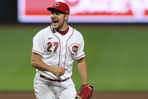 Cincinnati Reds' Trevor Bauer reacts after recording a strikeout against Milwaukee Brewers' Christian Yelich during a baseball game in Cincinnati, Wednesday, Sept. 23, 2020. The Reds won 6-1. (AP Photo/Aaron Doster)