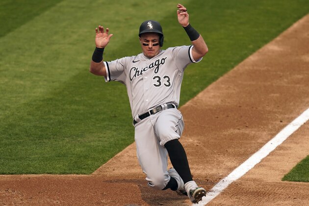 Chicago White Sox's James McCann slides into home to score against the Oakland Athletics during the third inning in Game 3 of an American League wild-card baseball series Thursday, Oct. 1, 2020, in Oakland, Calif. (AP Photo/Eric Risberg)