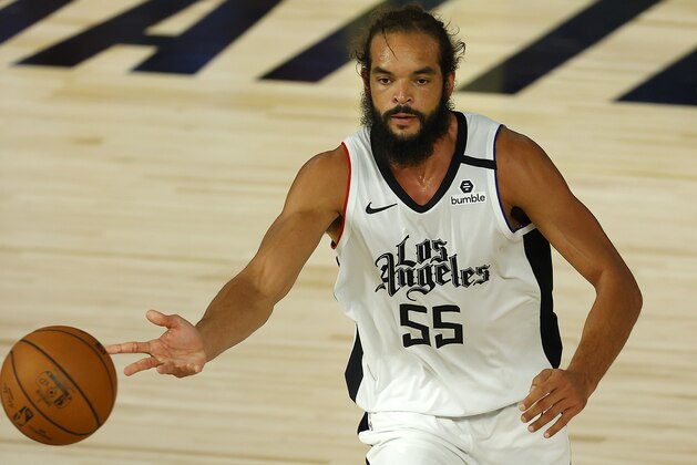 Los Angeles Clippers' Joakim Noah  dribbles the ball against the Oklahoma City Thunder during overtime in an NBA basketball game Friday, Aug. 14, 2020, in Lake Buena Vista, Fla. (Mike Ehrmann/Pool Photo via AP)