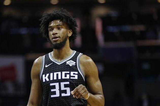Sacramento Kings forward Marvin Bagley III stands on the court during a break in the action against the Charlotte Hornets in the second half of an NBA basketball game in Charlotte, N.C., Tuesday, Dec. 17, 2019. Charlotte defeated Sacramento 110-102. (AP Photo/Nell Redmond)