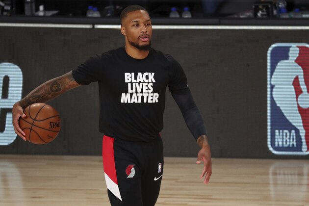 Portland Trail Blazers guard Damian Lillard (0) warms up before Game 2 of an NBA basketball first-round playoff series against the Los Angeles Lakers, Thursday, Aug. 20, 2020, in Lake Buena Vista, Fla. (Kim Klement/Pool Photo via AP)