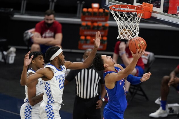 Kansas' Jalen Wilson (10) shoots in front of Kentucky's Isaiah Jackson (23) during the second half of an NCAA college basketball game Tuesday, Dec. 1, 2020, in Indianapolis. (AP Photo/Darron Cummings)