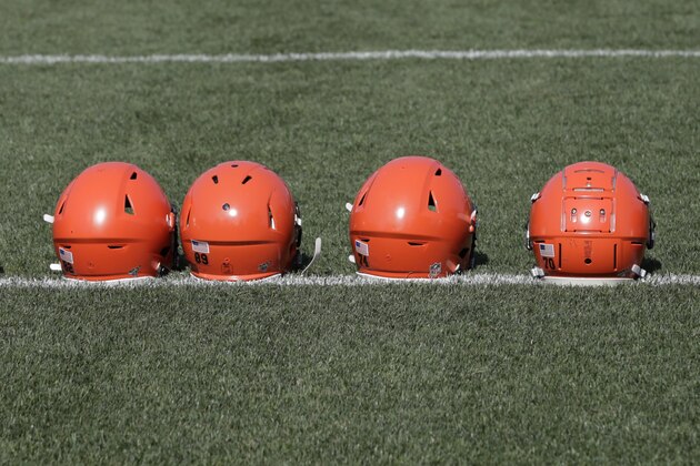 Cleveland Browns helmets line the field during practice at the NFL football team's training camp facility, Saturday, July 27, 2019, in Berea, Ohio. (AP Photo/Tony Dejak)