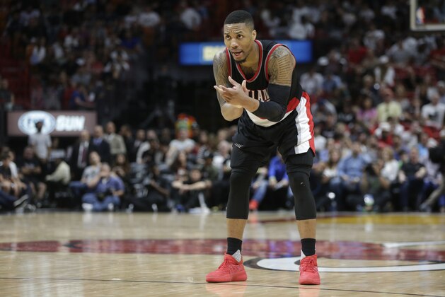 Portland Trail Blazers' Damian Lillard claps his hands during the second half of an NBA basketball game against the Miami Heat, Sunday, March 19, 2017, in Miami. The Trail Blazers won 115-104. (AP Photo/Lynne Sladky)
