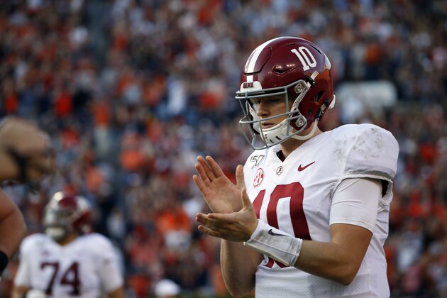 Alabama quarterback Mac Jones (10) walks off the field after throwing an pick six interception during the first half of an NCAA college football game against Auburn Saturday, Nov. 30, 2019, in Auburn, Ala. (AP Photo/Butch Dill)