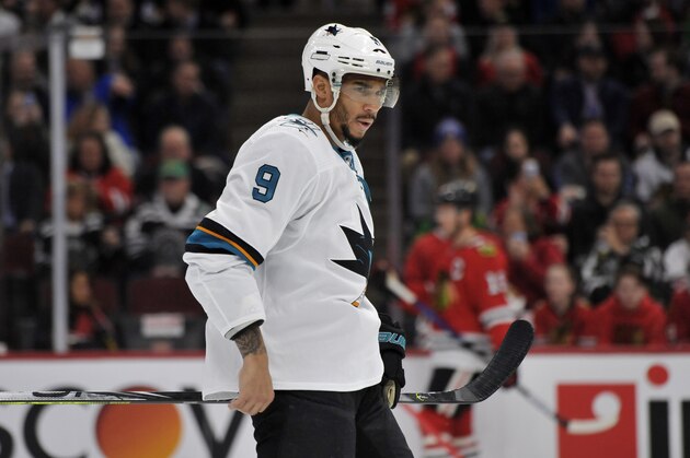 FILE - In this March 11, 2020 file photo, San Jose Sharks' Evander Kane (9) looks on during the first period of an NHL hockey game against the Chicago Blackhawks in Chicago.   The predominantly white sport of hockey has a checkered history of racism and a culture of not standing out from the team or speaking out. The death of George Floyd in Minnesota has shattered that silence.   (AP Photo/Paul Beaty, File)