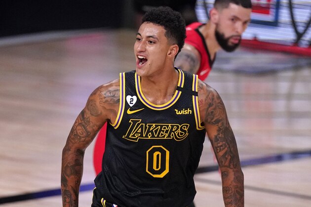 Los Angeles Lakers' Kyle Kuzma (0) celebrates a three-point basket scored by Markieff Morris during the first half of an NBA conference semifinal playoff basketball game against the Houston Rockets Sunday, Sept. 6, 2020, in Lake Buena Vista, Fla. (AP Photo/Mark J. Terrill) Los Angeles Lakers' Kyle Kuzma (0) celebrates a three-point basket scored by Markieff Morris during the first half of an NBA conference semifinal playoff basketball game against the Houston Rockets Sunday, Sept. 6, 2020, in Lake Buena Vista, Fla. (AP Photo/Mark J. Terrill)