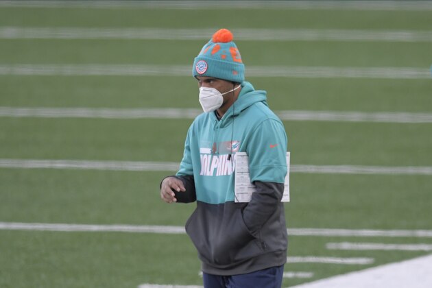 Miami Dolphins quarterback Tua Tagovailoa stands on the sidelines during the second half of an NFL football game against the New York Jets, Sunday, Nov. 29, 2020, in East Rutherford, N.J. (AP Photo/Bill Kostroun)