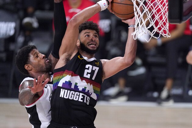 Denver Nuggets' Jamal Murray (27) goes up for a shot as Los Angeles Clippers' Paul George defends during the second half of an NBA conference semifinal playoff basketball game Sunday, Sept. 13, 2020, in Lake Buena Vista, Fla. (AP Photo/Mark J. Terrill) Denver Nuggets' Jamal Murray (27) goes up for a shot as Los Angeles Clippers' Paul George defends during the second half of an NBA conference semifinal playoff basketball game Sunday, Sept. 13, 2020, in Lake Buena Vista, Fla. (AP Photo/Mark J. Terrill)