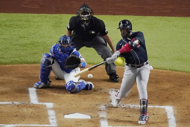 Atlanta Braves' Marcell Ozuna hits a RBI-single against the Los Angeles Dodgers during the first inning in Game 7 of a baseball National League Championship Series Sunday, Oct. 18, 2020, in Arlington, Texas. (AP Photo/Sue Ogrocki) Atlanta Braves' Marcell Ozuna hits a RBI-single against the Los Angeles Dodgers during the first inning in Game 7 of a baseball National League Championship Series Sunday, Oct. 18, 2020, in Arlington, Texas. (AP Photo/Sue Ogrocki)