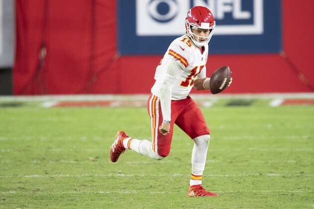Kansas City Chiefs quarterback Patrick Mahomes (15) runs with ball against the Tampa Bay Buccaneers during an NFL football game, Sunday, Nov. 29, 2020, in Tampa, Fla. (AP Photo/Doug Murray)