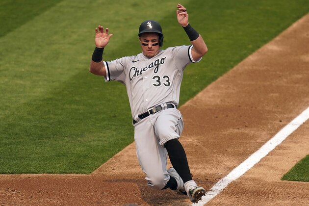 Chicago White Sox's James McCann slides into home to score against the Oakland Athletics during the third inning in Game 3 of an American League wild-card baseball series Thursday, Oct. 1, 2020, in Oakland, Calif. (AP Photo/Eric Risberg)