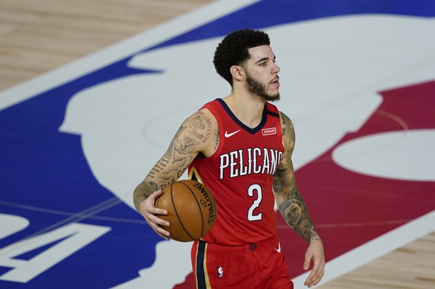 New Orleans Pelicans' Lonzo Ball (2) makes his way down the court during an NBA basketball game against the Memphis Grizzlies Monday, Aug. 3, 2020, in Lake Buena Vista, Fla. (AP Photo/Ashley Landis, Pool)