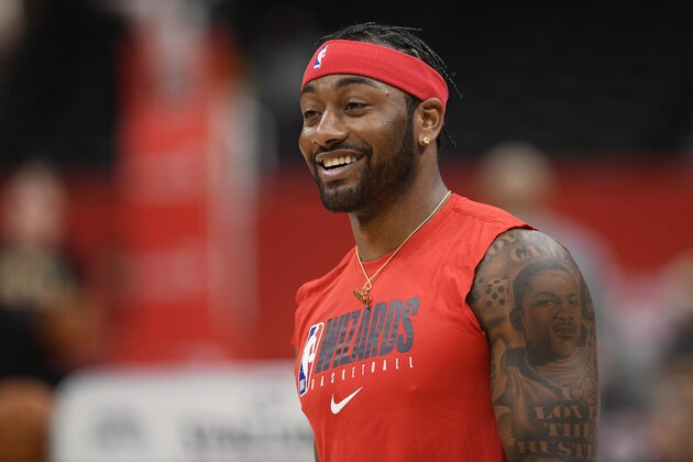 Washington Wizards guard John Wall works out prior to an NBA basketball game against the Milwaukee Bucks, Monday, Feb. 24, 2020, in Washington. (AP Photo/Nick Wass)