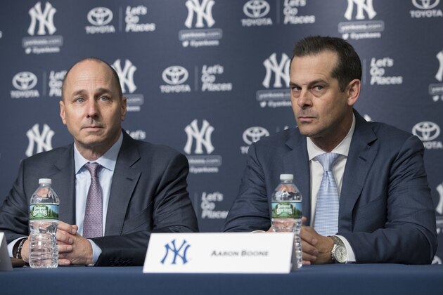 New York Yankees new manager Aaron Boone, right, sits with general manager Brian Cashman during a baseball news conference introducing Boone, Wednesday, Dec. 6, 2017, at Yankee stadium in New York. (AP Photo/Mary Altaffer)