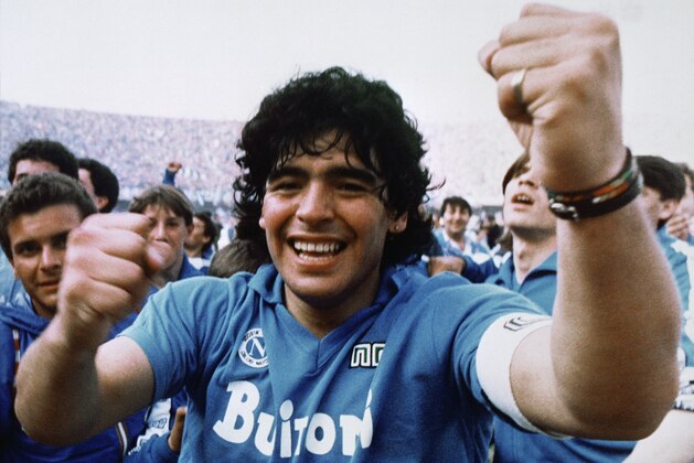 Argentine soccer superstar Diego Armando Maradona cheers after the Napoli team clinched its first Italian major league title in Naples, Italy, on May 10, 1987. Diego Maradona has died. The Argentine soccer great was among the best players ever and who led his country to the 1986 World Cup title before later struggling with cocaine use and obesity. He was 60. (AP Photo/Massimo Sambucetti, File )