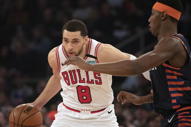 Chicago Bulls guard Zach LaVine (8) drives against New York Knicks guard RJ Barrett (9) during the first half of an NBA basketball game, Saturday, Feb. 29, 2020 in New York. (AP Photo/Mark Lennihan)