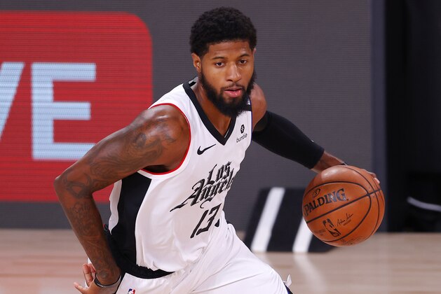 Los Angeles Clippers' Paul George drives against the Dallas Mavericks during the first quarter of Game 3 of an NBA basketball first-round playoff series, Friday, Aug. 21, 2020, in Lake Buena Vista, Fla. (Mike Ehrmann/Pool Photo via AP)