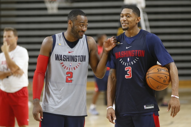 Washington Wizard guards John Wall, (2) and Bradley Beal, (3) share a laugh during practice at NBA basketball training camp in Richmond, Va., Thursday, Sept. 28, 2017. (AP Photo/Steve Helber)