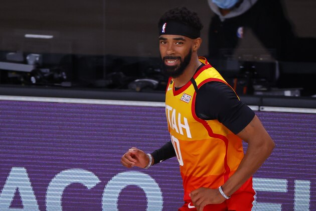 Utah Jazz's Mike Conley reacts to a 3-point basket against the Denver Nuggets during the third quarter of Game 4 of an NBA basketball first-round playoff series, Sunday, Aug. 23, 2020, in Lake Buena Vista, Fla. (Kevin C. Cox/Pool Photo via AP)