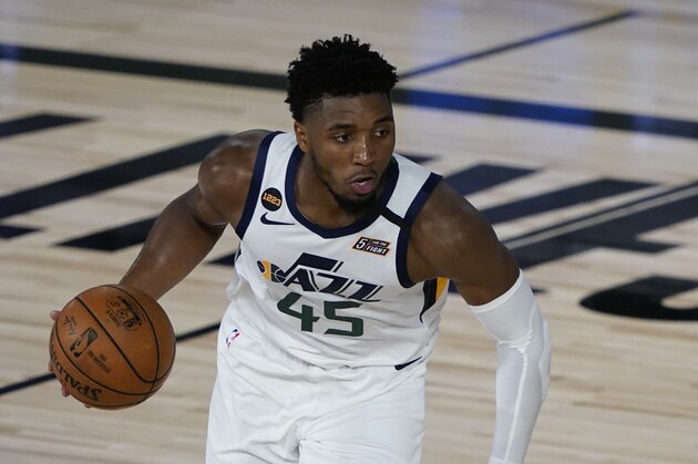 Utah Jazz guard Donovan Mitchell (45) takes the ball down the court during an NBA basketball game against the New Orleans Pelicans Thursday, July 30, 2020, in Lake Buena Vista, Fla. (AP Photo/Ashley Landis, Pool)
