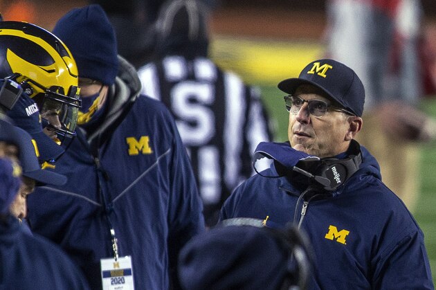 Michigan coach Jim Harbaugh stands on the sideline during the first quarter of the team's NCAA college football game against Wisconsin in Ann Arbor, Mich., Saturday, Nov. 14, 2020. (AP Photo/Tony Ding)