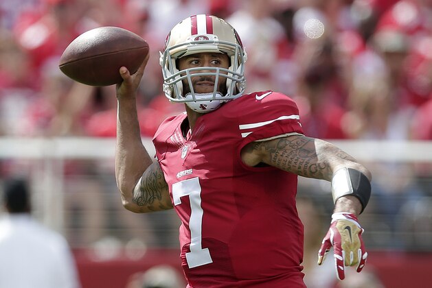 San Francisco 49ers quarterback Colin Kaepernick (7) passes against the Philadelphia Eagles during the first quarter of an NFL football game in Santa Clara, Calif., Sunday, Sept. 28, 2014. (AP Photo/Marcio Jose Sanchez)