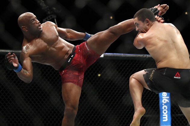 Robert Whittaker, right, and Yoel Romero fight during their middleweight Title bout at the UFC 225 Mixed Martial Arts event Sunday, June 10, 2018, in Chicago. (AP Photo/Jim Young)