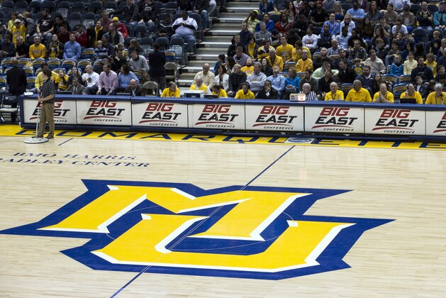 The Marquette University basketball court logo with the Big East logo behind it during a time out against Savannah State during the second half of an NCAA college basketball game, Saturday, Dec. 15, 2012, in Milwaukee. The seven Big East schools, including Marquette, that don't play FBS football have decided to leave the conference and pursue a new basketball framework. The other schools are: Georgetown, St. John's, Villanova, DePaul, Seton Hall and Providence. (AP Photo/Tom Lynn)