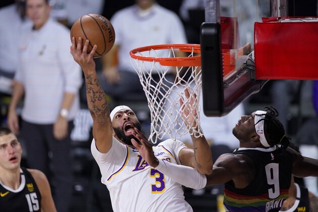 Los Angeles Lakers forward Anthony Davis (3) goes up for a shot as Denver Nuggets forward Jerami Grant (9) defends during the first half of Game 3 of the NBA basketball Western Conference final Tuesday, Sept. 22, 2020, in Lake Buena Vista, Fla. (AP Photo/Mark J. Terrill)