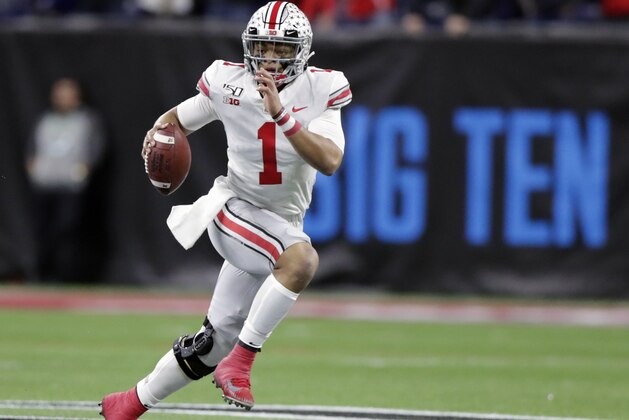 FILE - In this Dec. 7, 2019, file photo, Ohio State quarterback Justin Fields (1) runs with the ball against Wisconsin during the first half of the Big Ten championship NCAA college football game, in Indianapolis. The ACC, Big 12 and SEC have been playing anywhere from three to five weeks amid the pandemic, and all the players and coaches around the Big Ten could do is watch. “Most of it's been torture, just not being able to play games,” Ohio State coach Ryan Day said. (AP Photo/Michael Conroy, File)