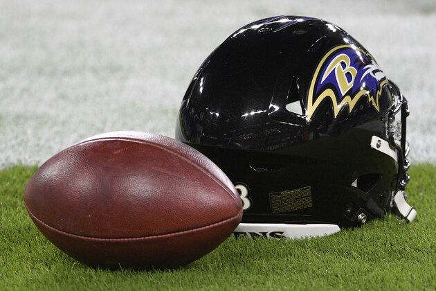 A Baltimore Ravens helmet and a football are seen before an NFL football game between the Kansas City Chiefs and the Baltimore Ravens, Monday, Sept. 28, 2020, in Baltimore. (AP Photo/Nick Wass)