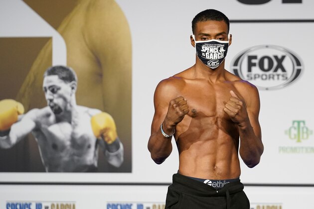 Boxer Errol Spence Jr., poses during weigh-in for a title match against Danny Garcia in Dallas, Friday, Dec. 4, 2020. Spence Jr. is putting his WBC and IBF welterweight titles on the line against Danny Garcia in his first fight since escaping serious injury in a high-speed car wreck in Dallas that led to misdemeanor drunken driving charges and could have derailed a promising career. The 30-year-old Spence is undefeated in 26 fights with 21 knockouts. Garcia, a 32-year-old from Philadelphia, is 36-2 and has 21 knockouts as well.(AP Photo/Tony Gutierrez)