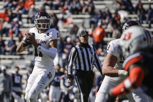 Texas A&M quarterback Kellen Mond (11) looks to pass against Auburn during the first half of an NCAA college football game on Saturday, Dec. 5, 2020, in Auburn, Ala. (AP Photo/Butch Dill)