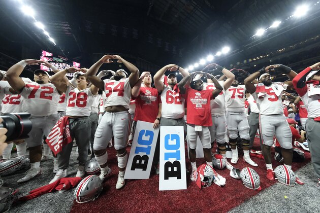 FILE - In this Dec. 8, 2019, file photo, Ohio State players celebrate the team's 34-21 win over Wisconsin in the Big Ten championship NCAA college football game, in Indianapolis. The Big Ten won't play football this fall because of concerns about COVID-19, becoming the first of college sports' power conferences to yield to the pandemic. The move announced Tuesday, Aug. 11, 2020, comes six day after the conference that includes historic programs such as Ohio State, Michigan, Nebraska and Penn State had released a revised conference-only schedule that it hoped would help it navigate a fall season with potential COVID-19 disruptions.(AP Photo/AJ Mast, File) FILE - In this Dec. 8, 2019, file photo, Ohio State players celebrate the team's 34-21 win over Wisconsin in the Big Ten championship NCAA college football game, in Indianapolis. The Big Ten won't play football this fall because of concerns about COVID-19, becoming the first of college sports' power conferences to yield to the pandemic. The move announced Tuesday, Aug. 11, 2020, comes six day after the conference that includes historic programs such as Ohio State, Michigan, Nebraska and Penn State had released a revised conference-only schedule that it hoped would help it navigate a fall season with potential COVID-19 disruptions.(AP Photo/AJ Mast, File)