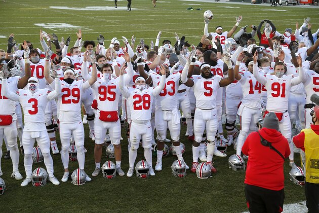 Ohio State players celebrate following an NCAA college football game against Michigan State, Saturday, Dec. 5, 2020, in East Lansing, Mich.  (AP Photo/Al Goldis)