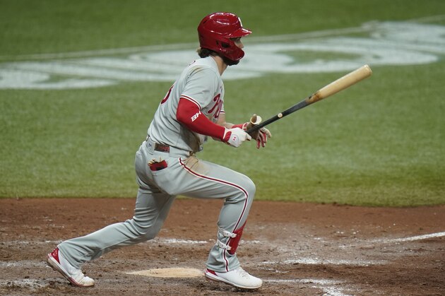 Philadelphia Phillies' Bryce Harper hits an RBI single off Tampa Bay Rays relief pitcher Aaron Slegers during the seventh inning of a baseball game Saturday, Sept. 26, 2020, in St. Petersburg, Fla. (AP Photo/Chris O'Meara)